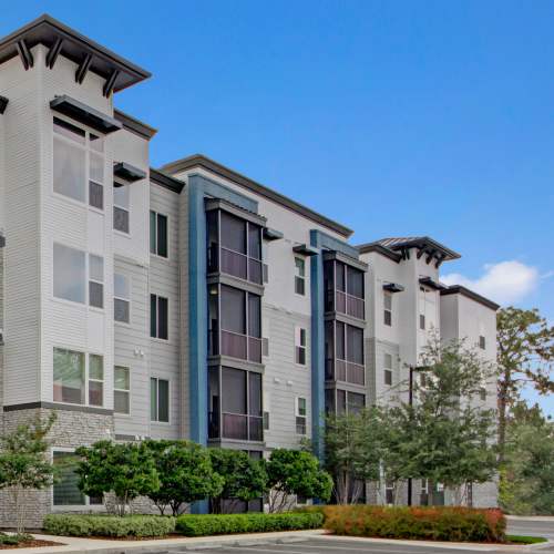 Exterior view with parking space at The Courtney at Lake Shadow in Orlando, Florida