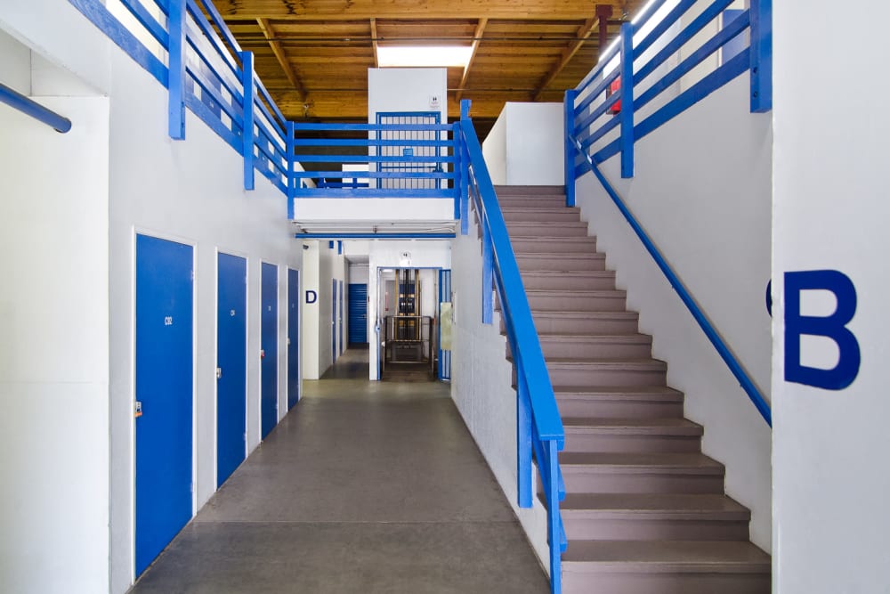 Ground-floor storage lockers and staircase at  A-American Self Storage in Santa Barbara, California