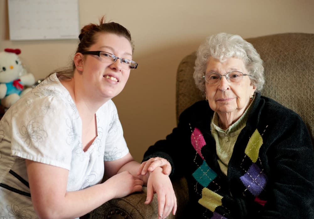 Resident spending time with their favorite caretaker at The Residences on Forest Lane in Montello, Wisconsin