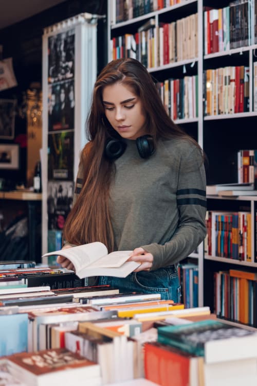 Resident browsing books at a local bookstore near Parallel 36 at Jailette in Atlanta, Georgia