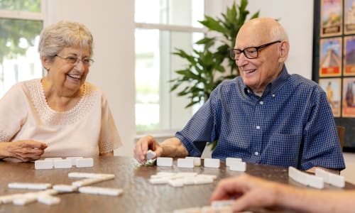 Residents playing dominoes at The Barclay at Little River in Little River, South Carolina