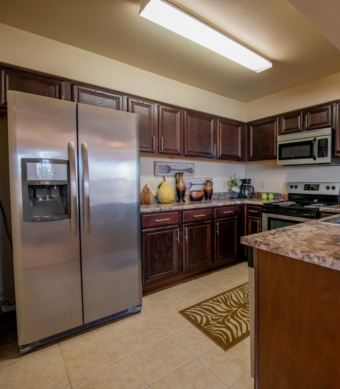 Kitchen with granite countertops at Park at Tuscany in Oklahoma City, Oklahoma