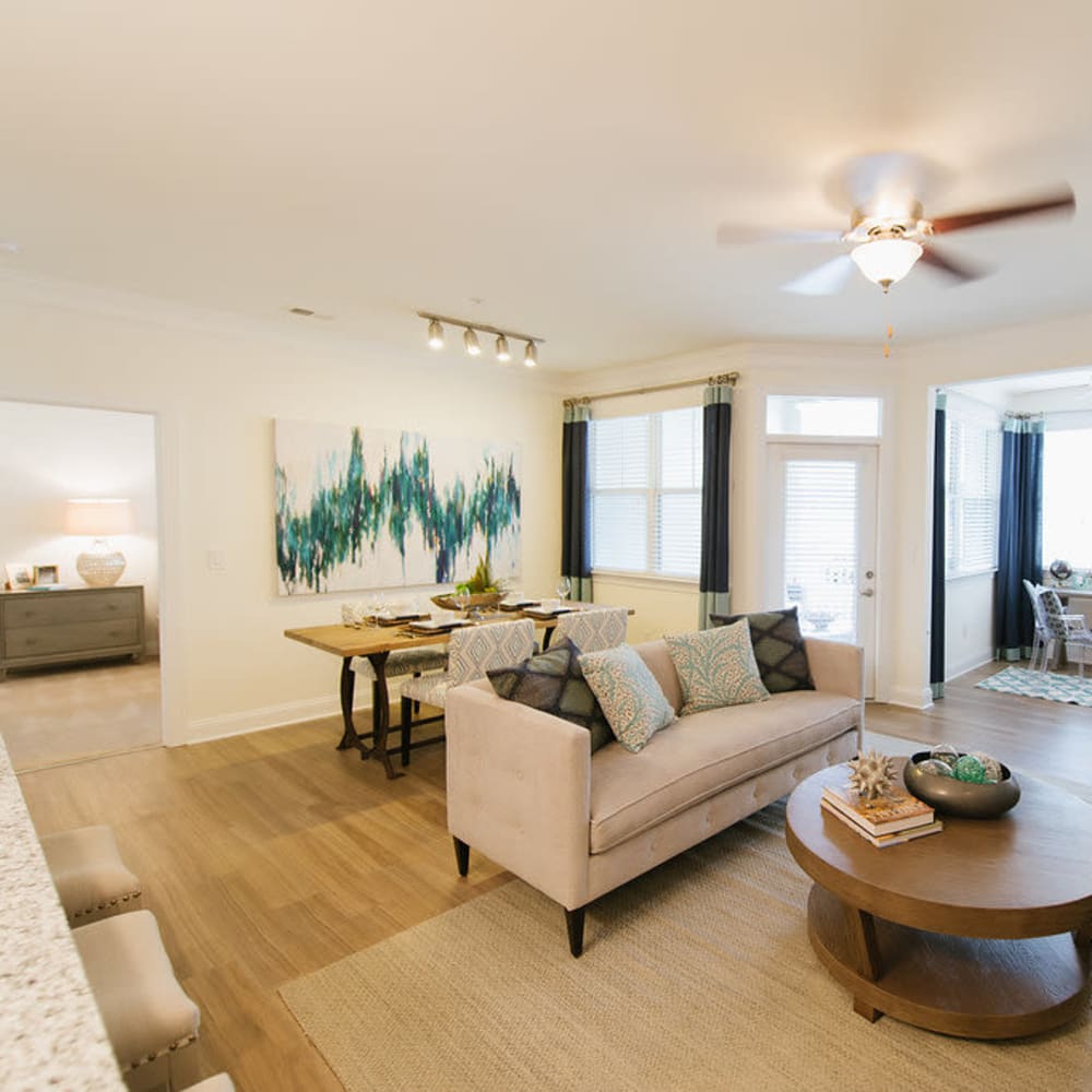 Living area with wood-style flooring at Beacon on 5th in Charlottesville, Virginia