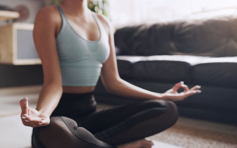 Resident getting their yoga in for the day at The Abbey at Energy Corridor in Houston, Texas