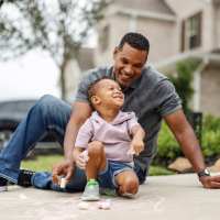 Father and child near Sagamore Apartments in Benbrook, Texas