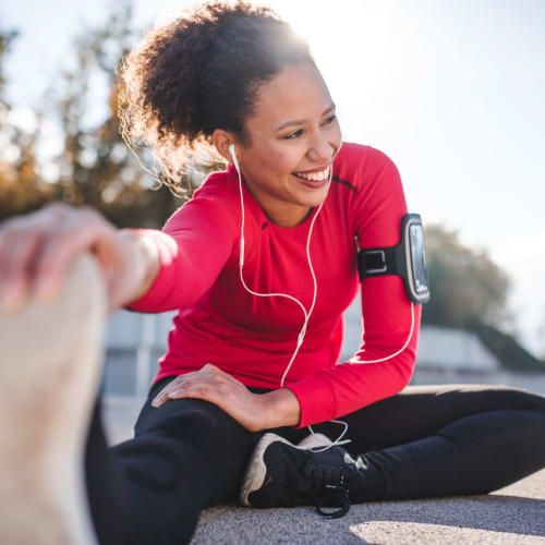 Relaxing stretching at a park near Siena Villas Apartments in Elk Grove, California