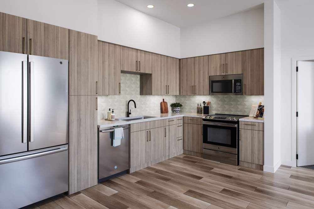 Kitchen with stainless steel appliances and brown cabinets