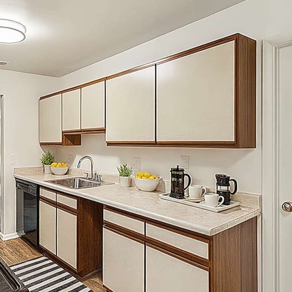Functional kitchen with granite countertops at 83 West Townhomes in West Bloomfield Township, Michigan