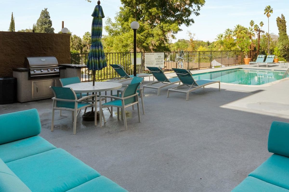 Barbeque area near pool at Amanda Regency Apartments, Van Nuys, California