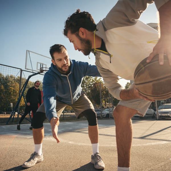 Residents playing basketball at The Quarters at Iowa City in Iowa City, Iowa