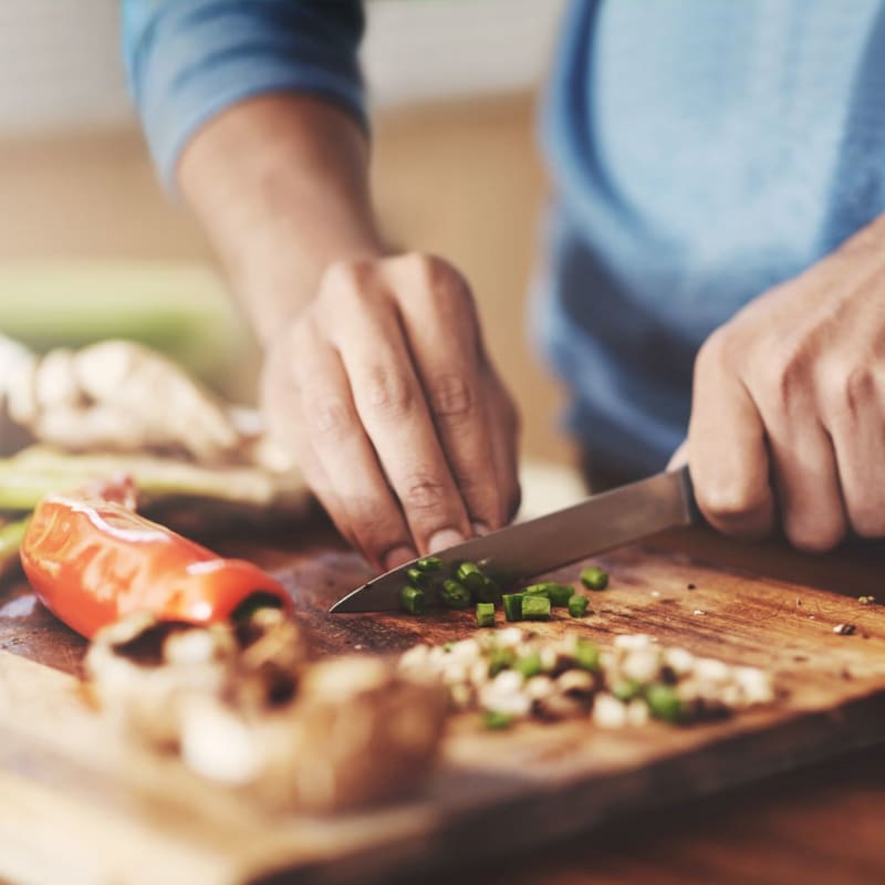 Resident prepping some food at Mercado Apartments in Perris, California