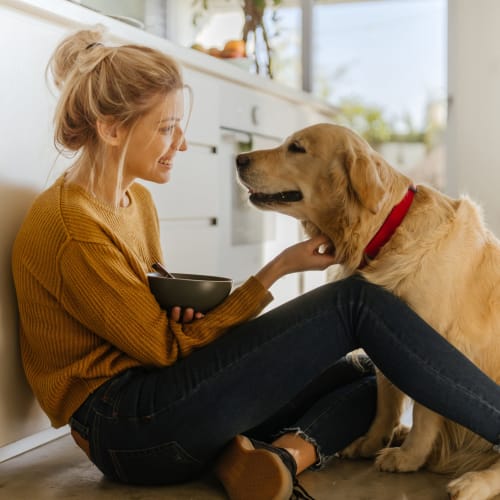 A resident petting her dog at Mosby Bridge Street in Huntsville, Alabama