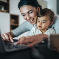 Resident and her son surfing the web at Tuscany Park in San Antonio, Texas