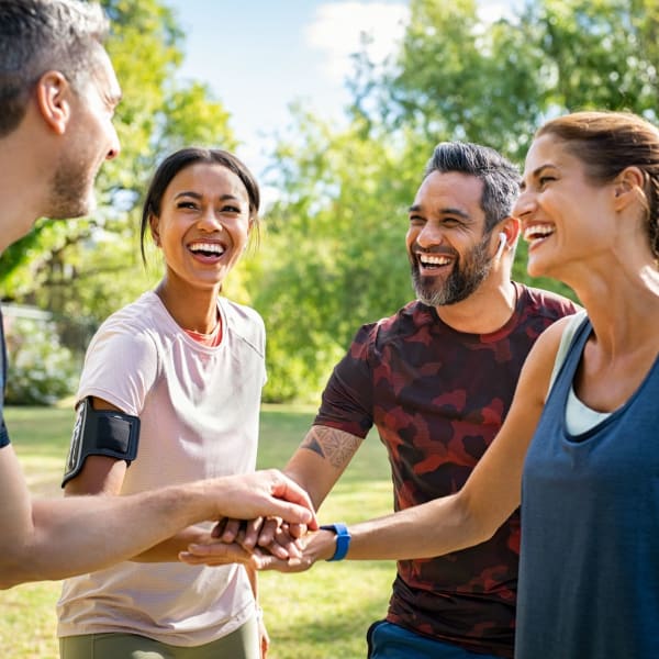 Happy friends enjoying the weather at park near Symphony Property Management in Buffalo, New York