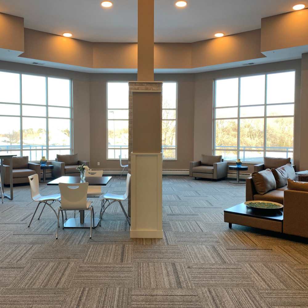 Community clubhouse with seatings and large window at Depot on Main in Zimmerman, Minnesota