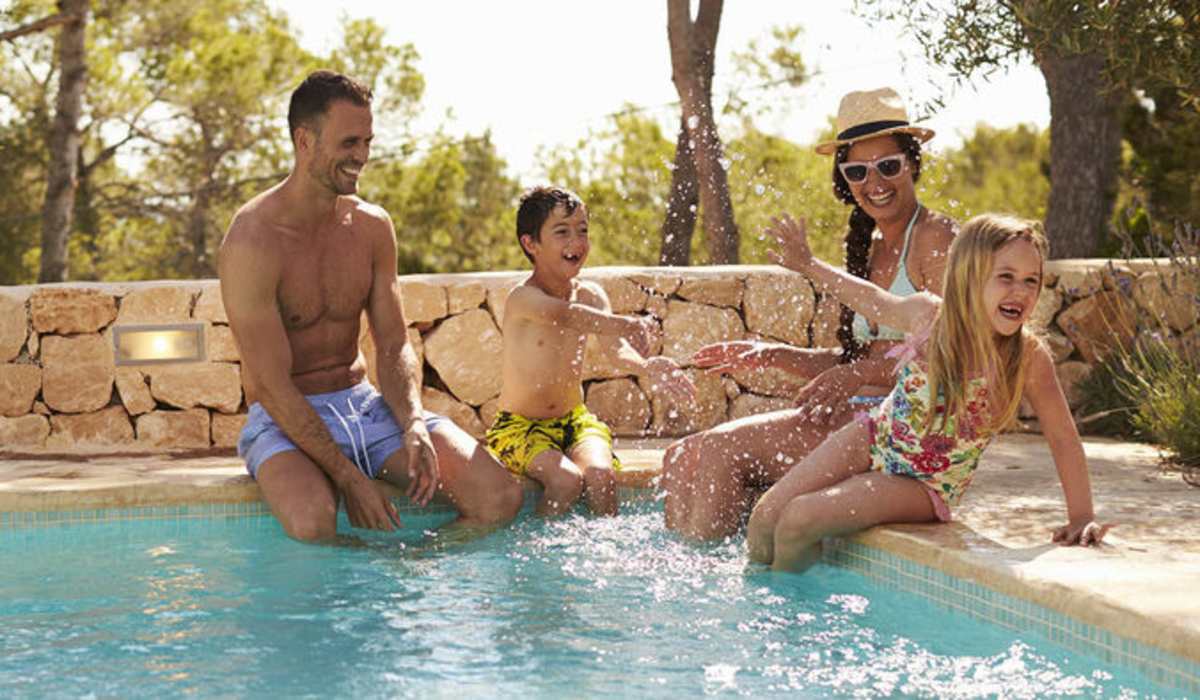 Residents relaxing by the pool at Potranco Commons in San Antonio, Texas