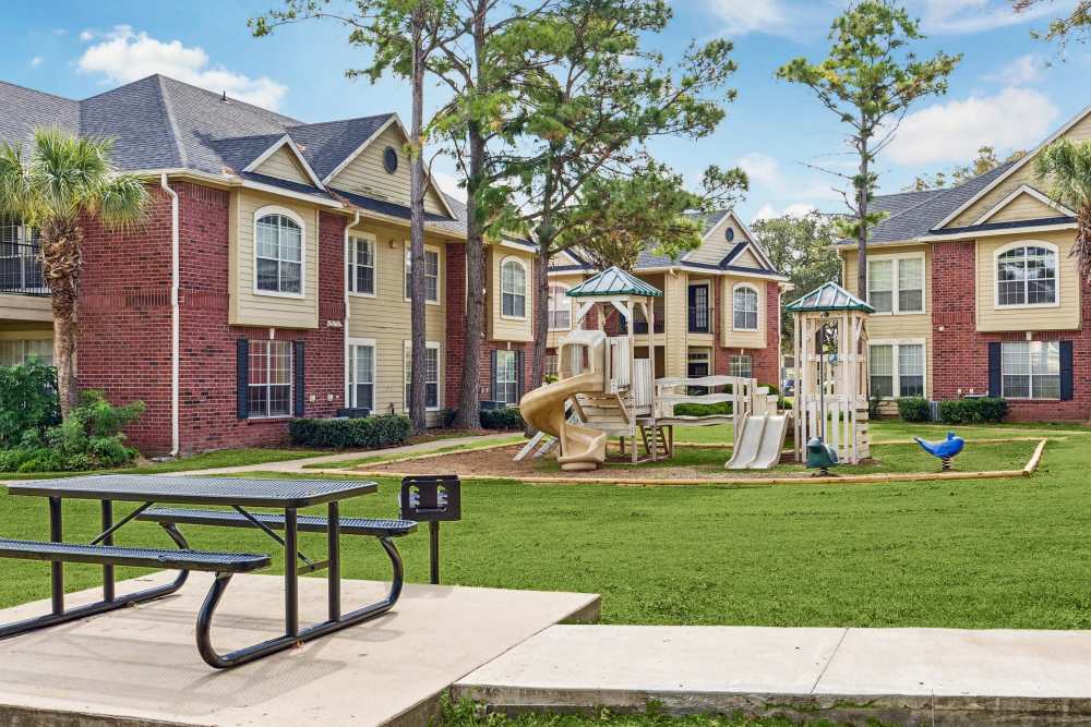 Playground with slides at Brazoswood Apartments in Clute, Texas