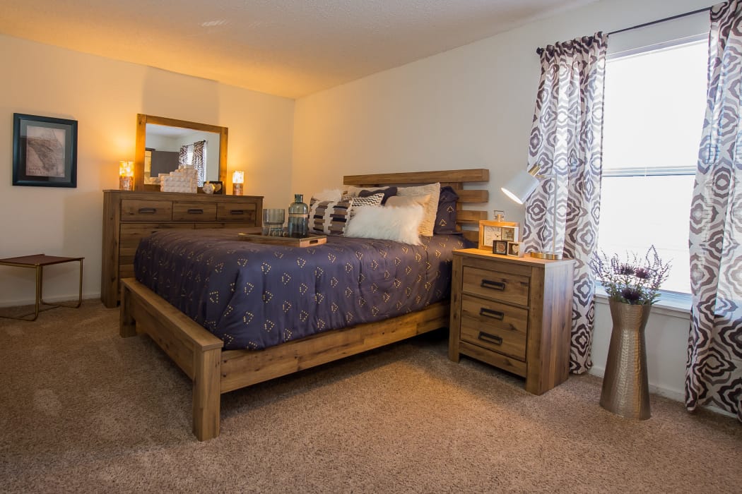 Well-lit bedroom at Fox Run Apartments in Wichita, Kansas