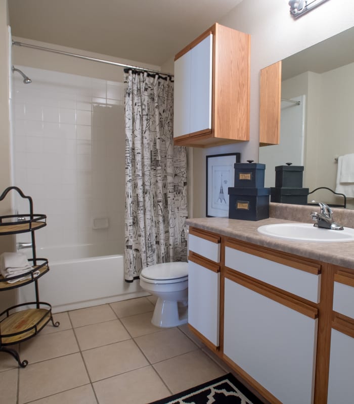 Bathroom with tile flooring at Villas at Stonebridge in Edmond, Oklahoma