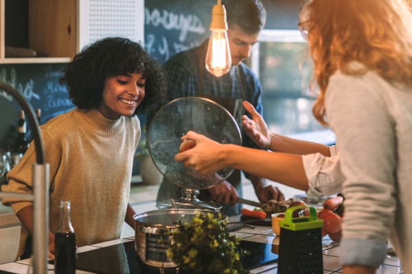 Residents cooking in their apartment at Fusion in Jacksonville, Florida