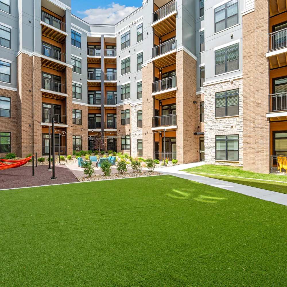 Green lawn in front of community apartment at Neo Vantage Point in Maryland Heights, Missouri
