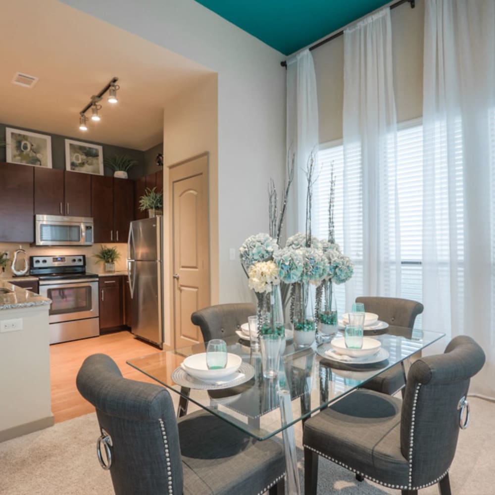 Dining area and kitchen of a model home at Imperial Lofts in Sugar Land, Texas