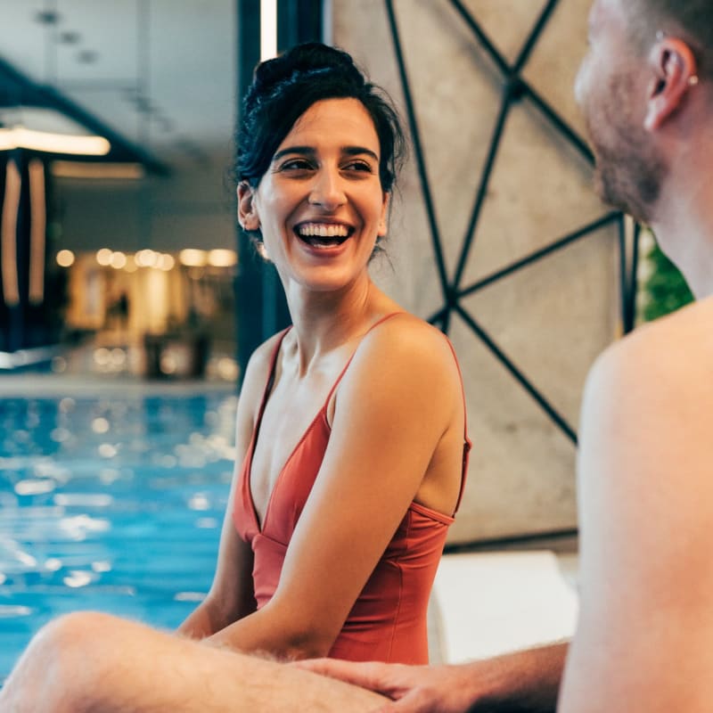 Residents sit poolside at Pinnacle Apartments, Hampton, Virginia