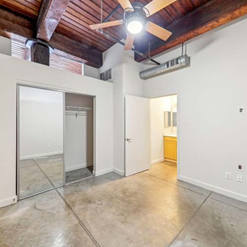 Unfurnished bedroom with walk-in closet at Stadium Loft Apartments in Saint Louis, Missouri