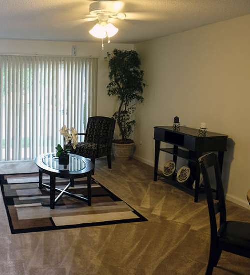 Living room with windows at The Hills in San Diego, California