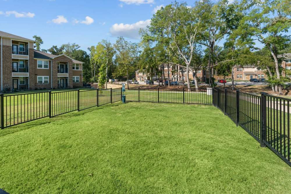 Fenced dog park at Pebble Brook Apartments in Jacksonville, Texas