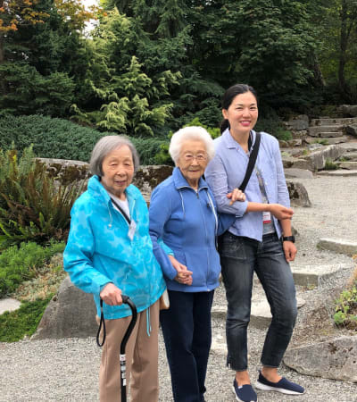 Volunteer with two senior ladies at Nikkei Manor in Seattle, Washington