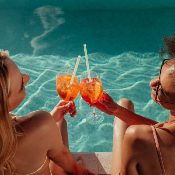 Residents enjoy a cocktail poolside at Attain at Quarterpath, Williamsburg, Virginia