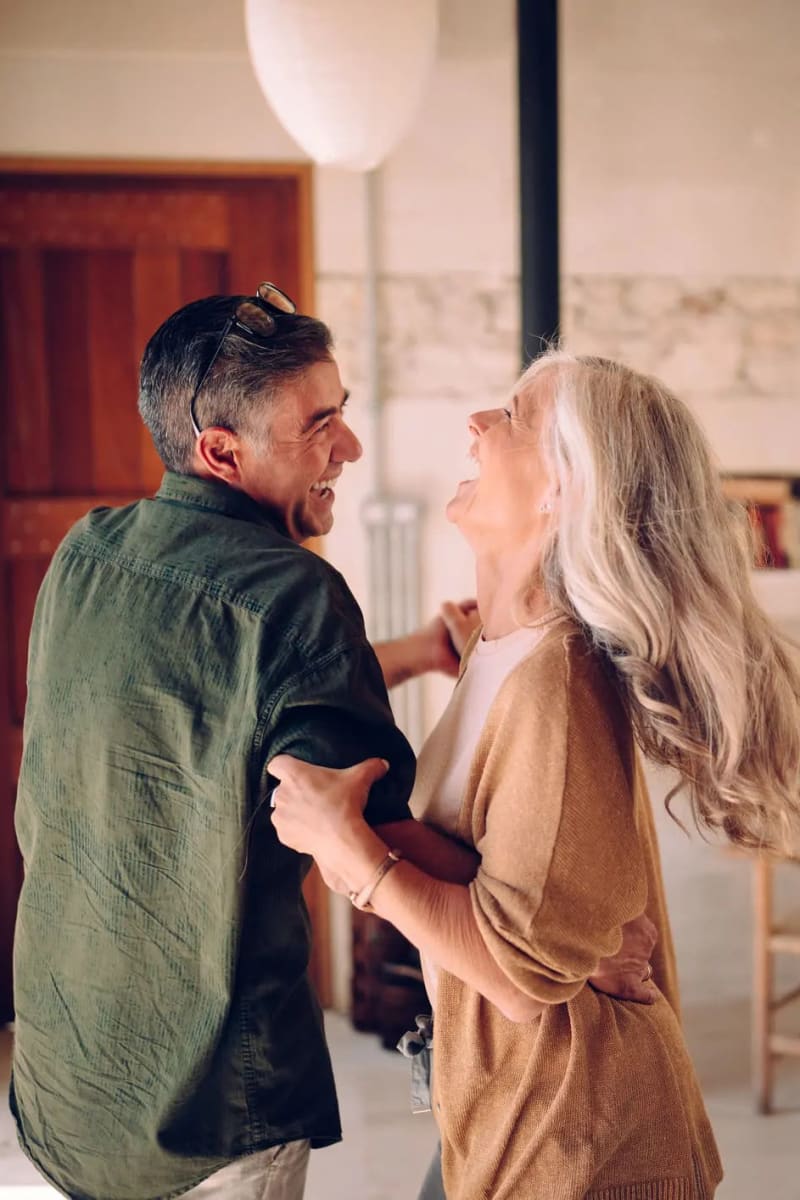 Resident couple dancing at Carriage Inn Conroe in Conroe, Texas