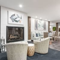 Modern furnishings in a model apartment's primary bedroom at The Greyson in Hilliard, Ohio