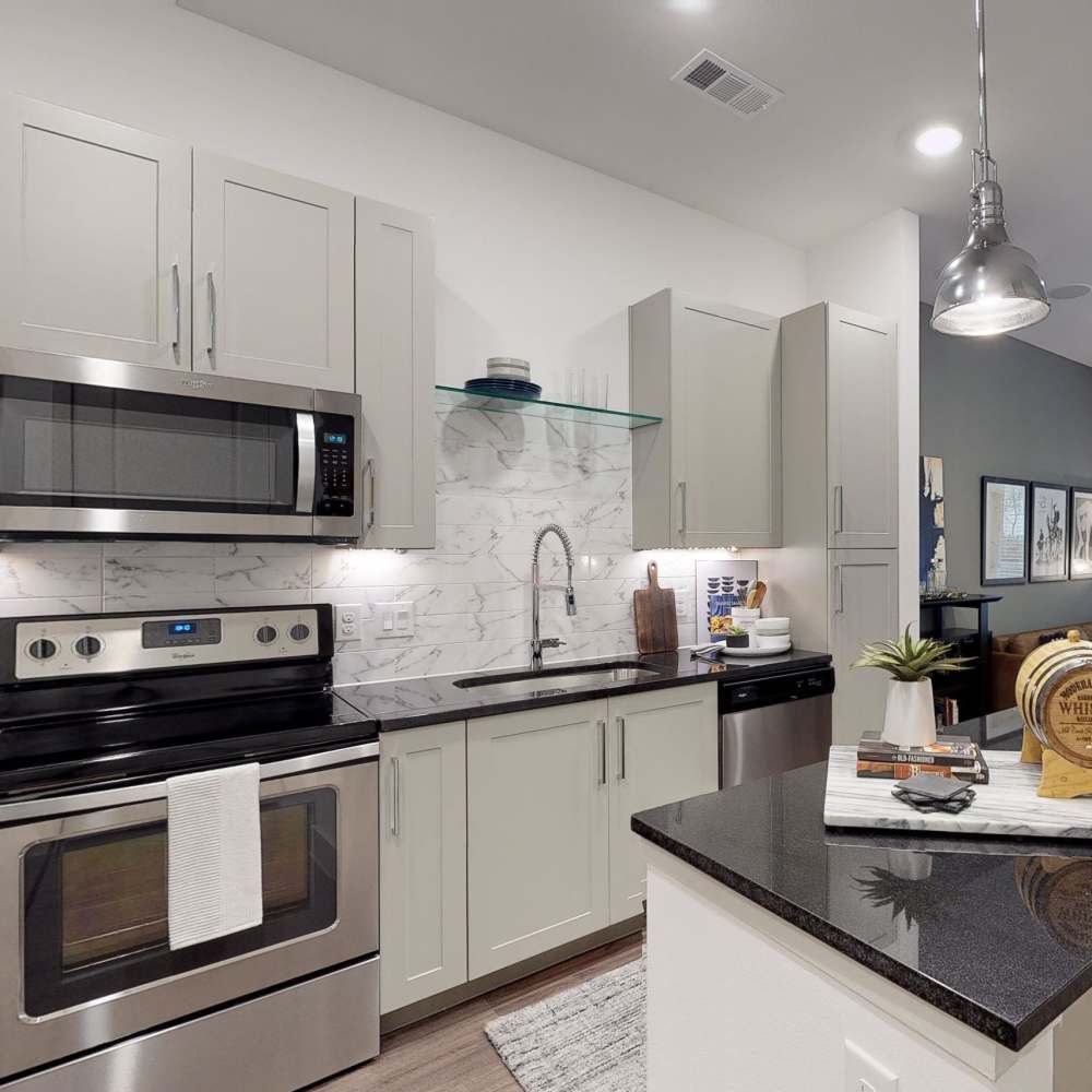 Kitchen with granite countertop at Howell Uptown in Dallas,Texas