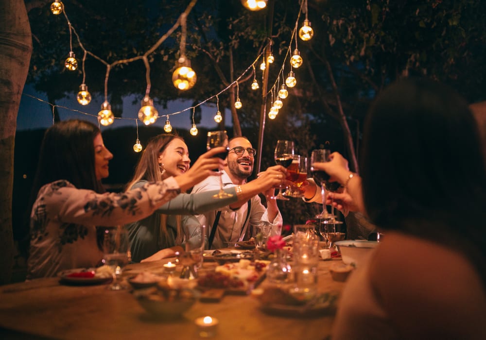 Friends enjoying dinner and wine in Merrimack, New Hampshire near London Court Apartments
