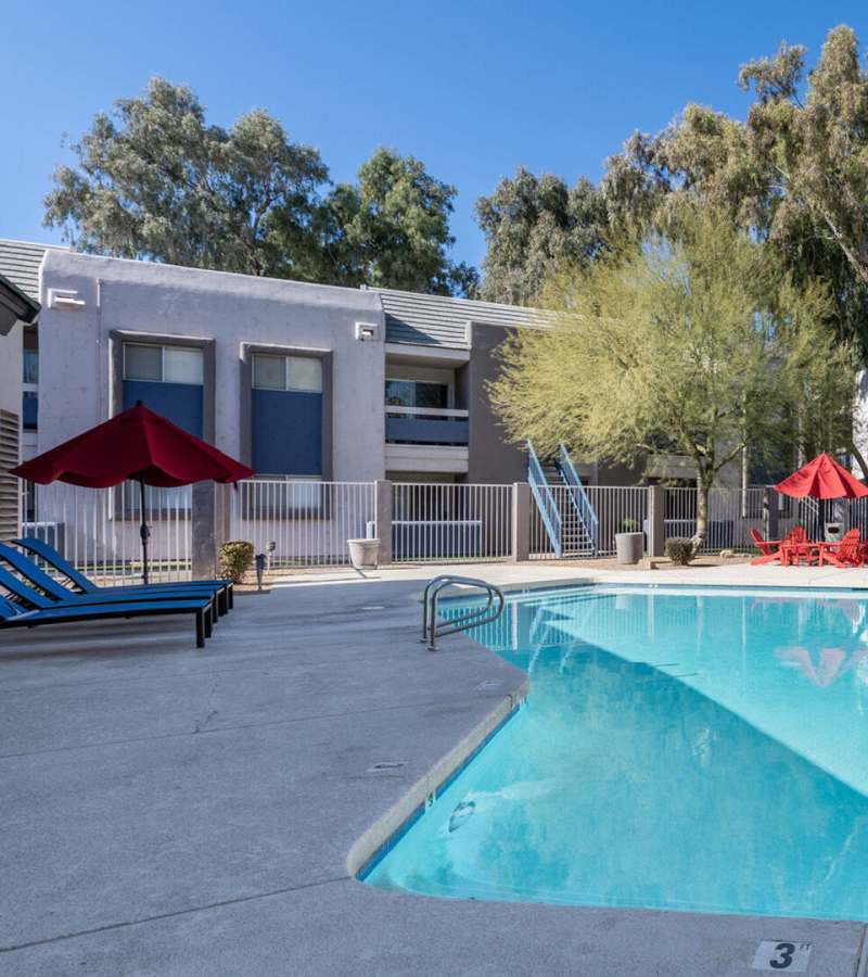 Swimming pool with sundecks covered with pergola at 544 Southern Apartments in Mesa, Arizona