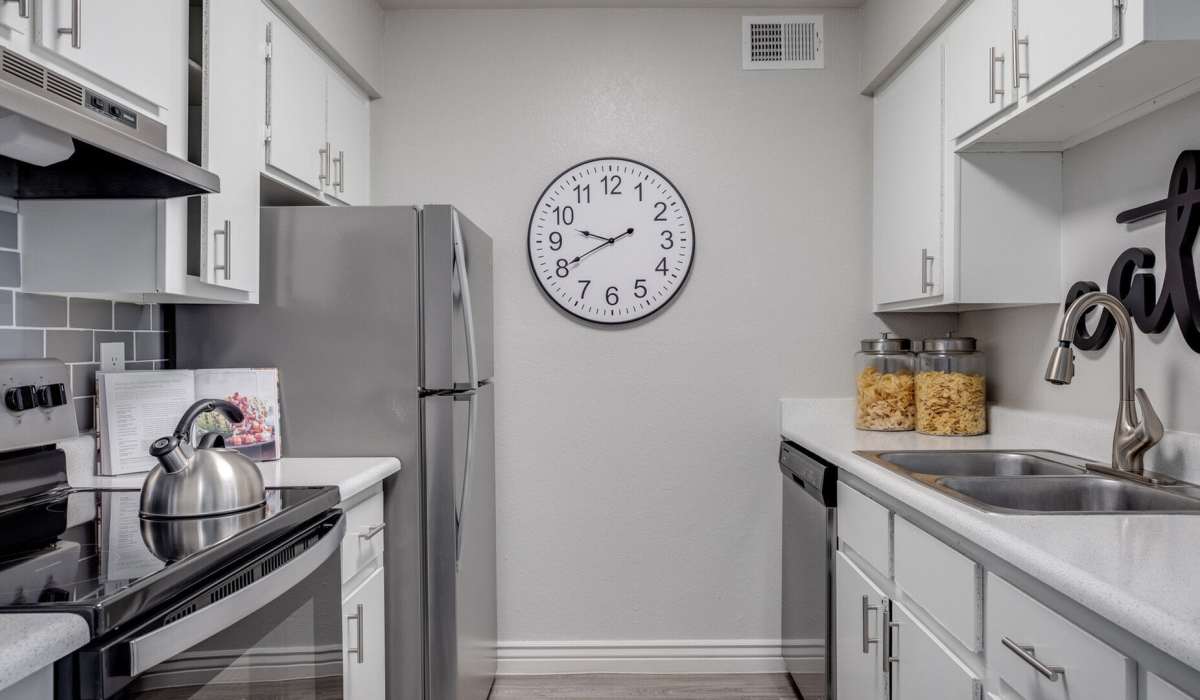 Ultra-modern kitchen quartz countertops, and white accent wood cabinetry at 544 Southern Apartments in Mesa, Arizona