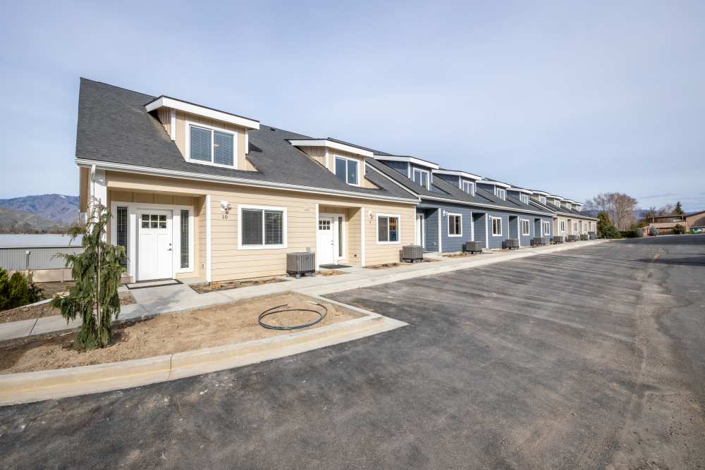 Community exterior with parking spaces at 14th Street Townhomes in East Wenatchee, Washington