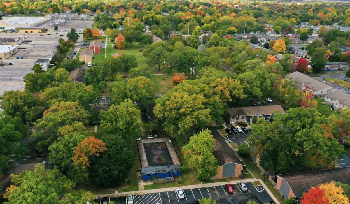 Scenic view of lush landscaping and vibrant autumn foliage at a charming community in Mishawaka, Indiana.
