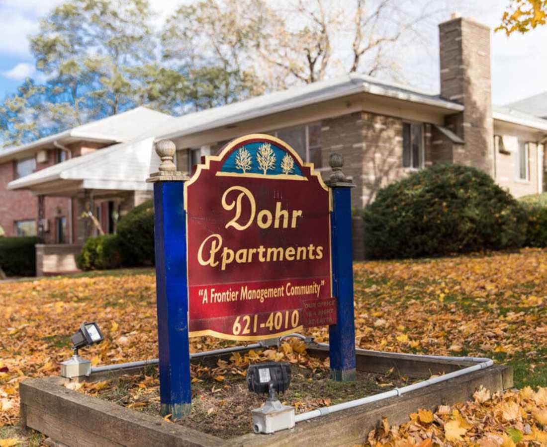 Sign board of dohr apartment with red color board at Dohr Apartments in Rochester, New York