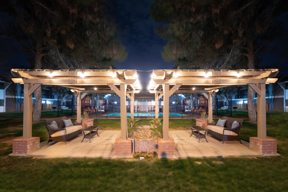 Outdoor resident lounge area at night at La Privada Apartments in El Paso, Texas