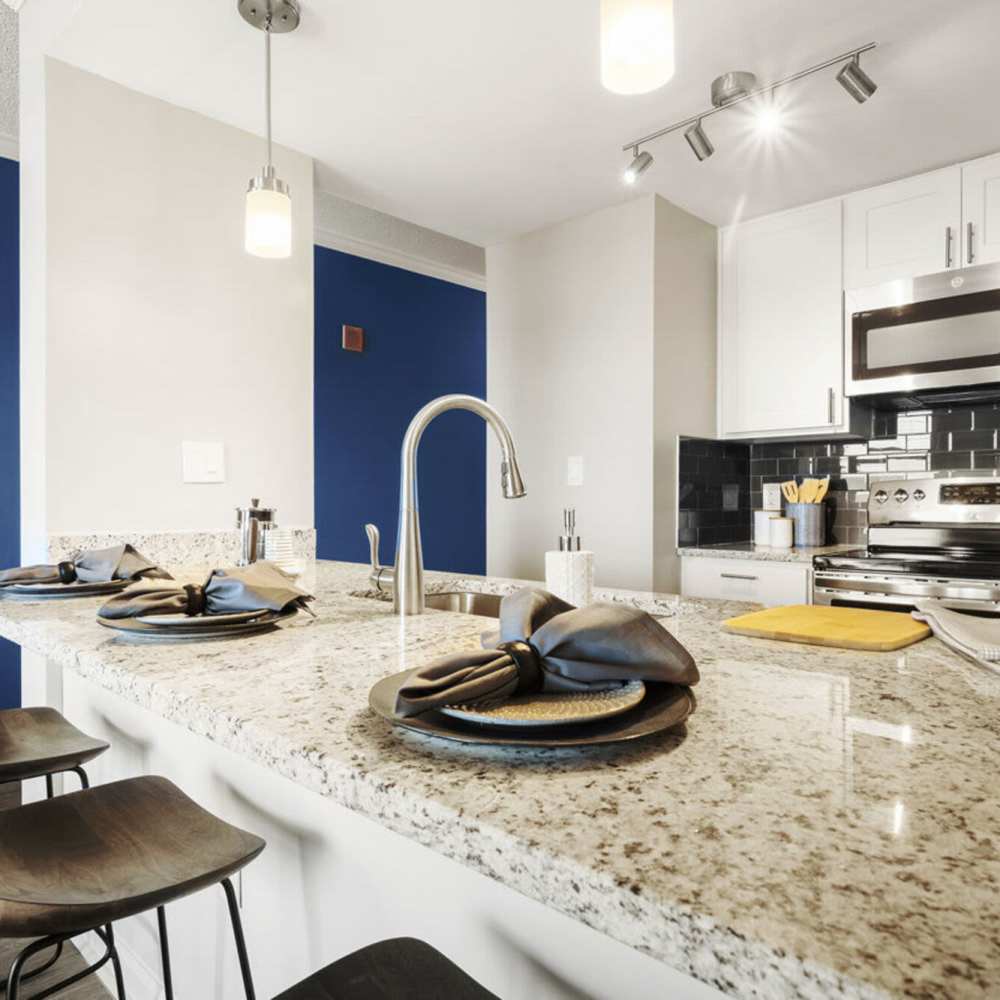 Kitchen countertop with plate and napkin at The Eva in Sandy Springs, Georgia