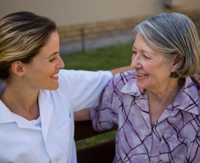 Resident and caregiver at St. Anthony's Senior Living enjoying a moment