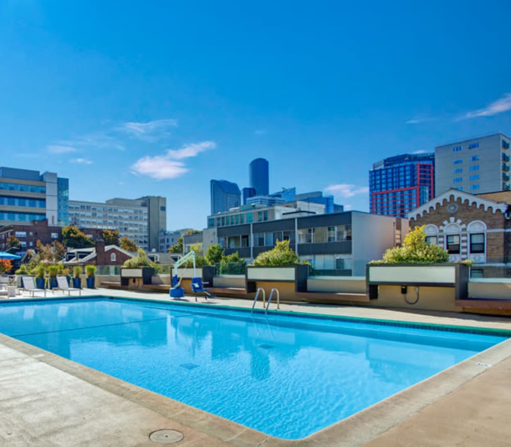 Exterior view of our community with a pool at Panorama Apartments in Seattle, Washington