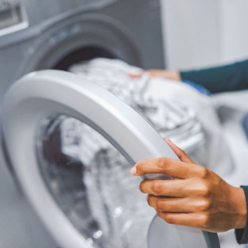 Resident doing laundry at Oak Park in Turlock, California