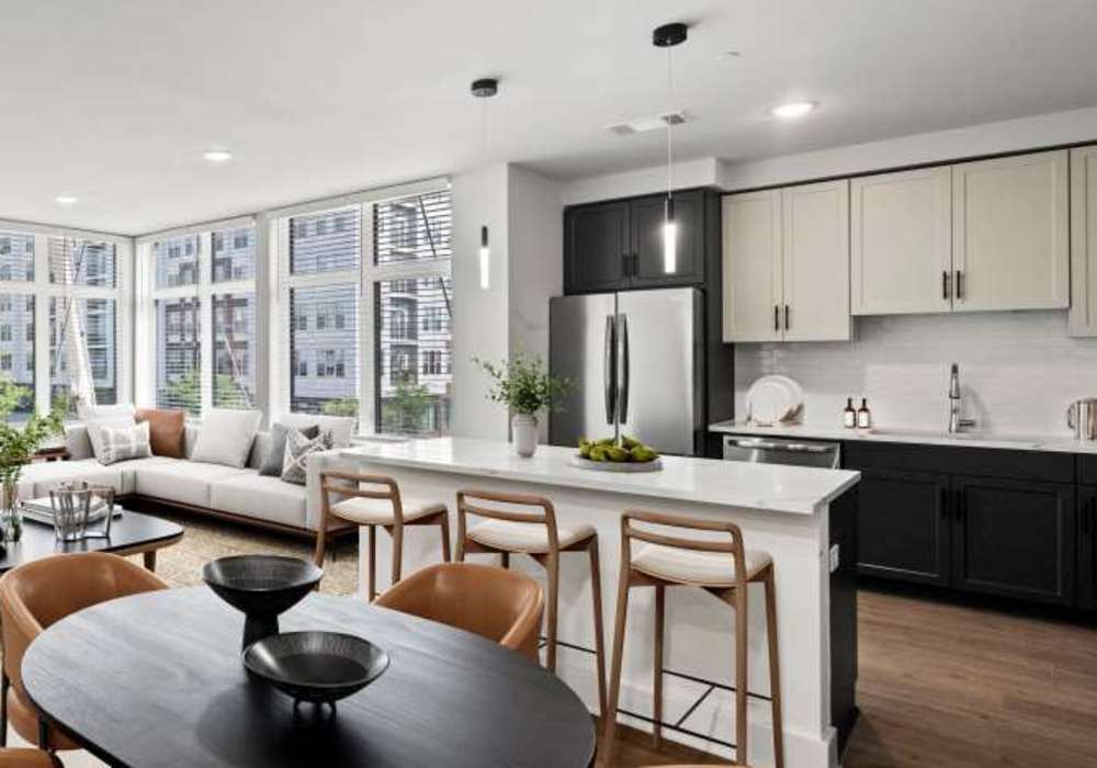 A view of the kitchen with dinning space at The Maximilian at Stonefield in Charlottesville, Virginia