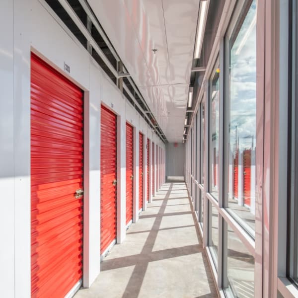 Indoor storage units with bright doors at StorQuest Self Storage in Santa Clarita, California