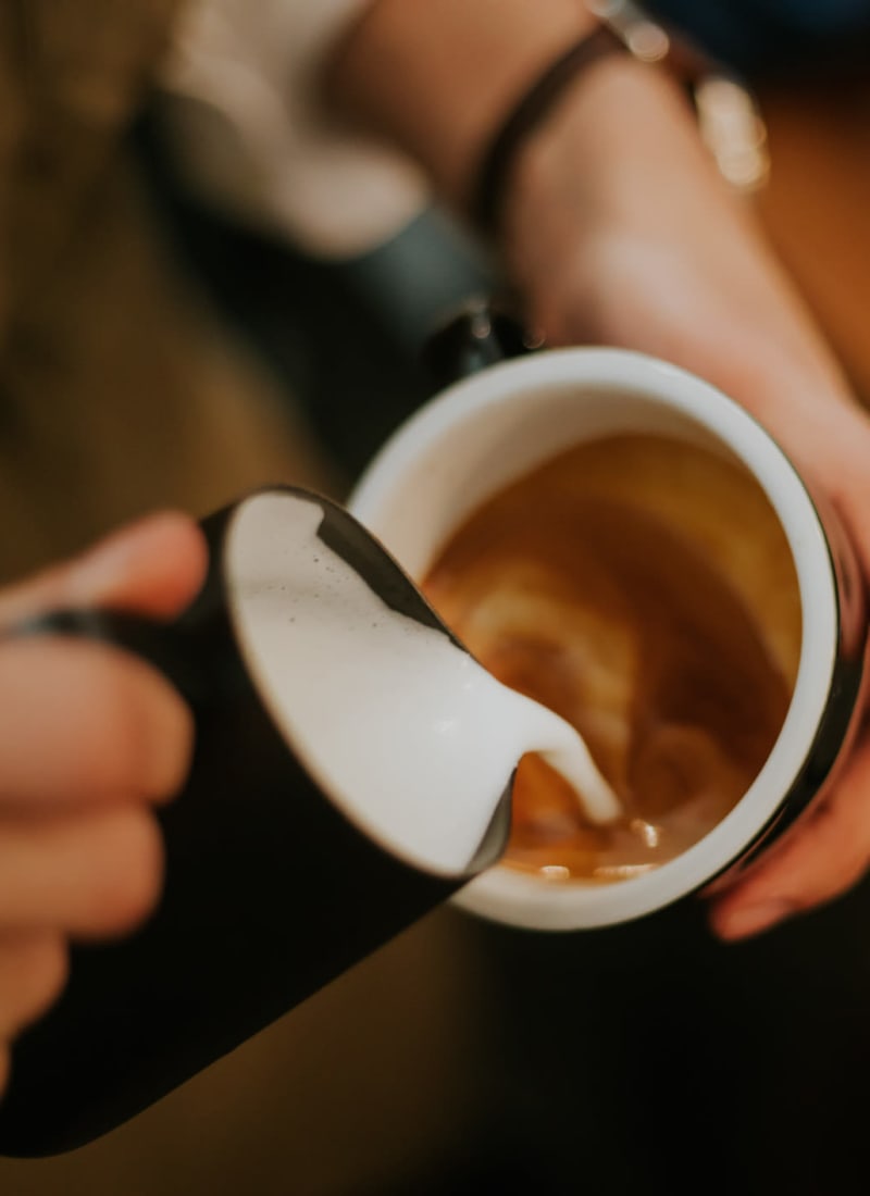 Barista making latte near Marquis at Bellaire Ranch in Fort Worth, Texas