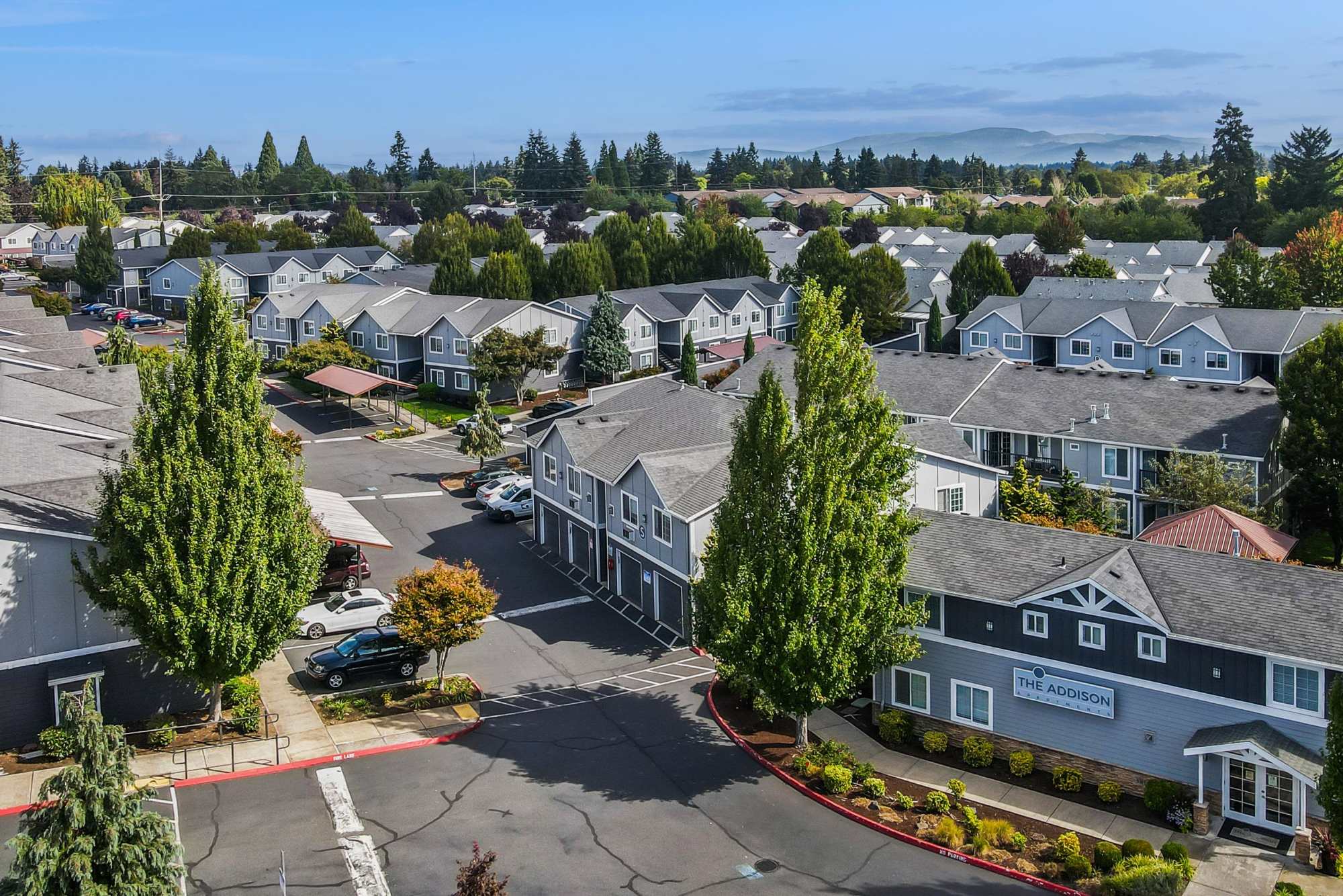 Aerial view of the community with lush landscaping at The Addison Apartments in Vancouver, Washington